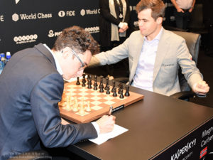 Fabiano Caruana and Magnus Carlsen at the start of game 10, FIDE World Chess Championship 2018 | Photograph by John Lee Shaw © www.hotoffthechess.com.