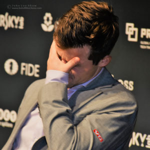 Magnus Carlsen, after Round 11, FIDE World Chess Championship 2018 | Photograph by John Lee Shaw © www.hotoffthechess.com.