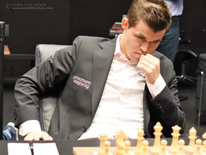 Magnus Carlsen at the start of round 7 of the FIDE World Chess Championship 2018. Photograph by John Lee Shaw © www.hotoffthechess.com.